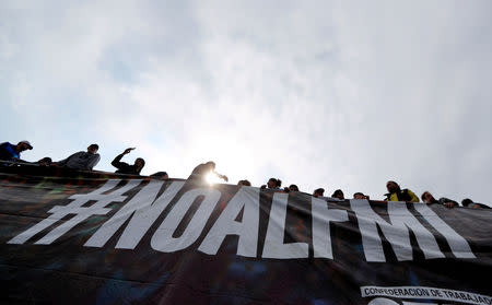 Leaders of workers organizations speak from a trailer above a banner that reads “No to the IMF (International Monetary Fund)” on 9 de Julio avenue during a demonstration against the government’s economic measures in Buenos Aires, Argentina September 12, 2018. REUTERS/Marcos Brindicci