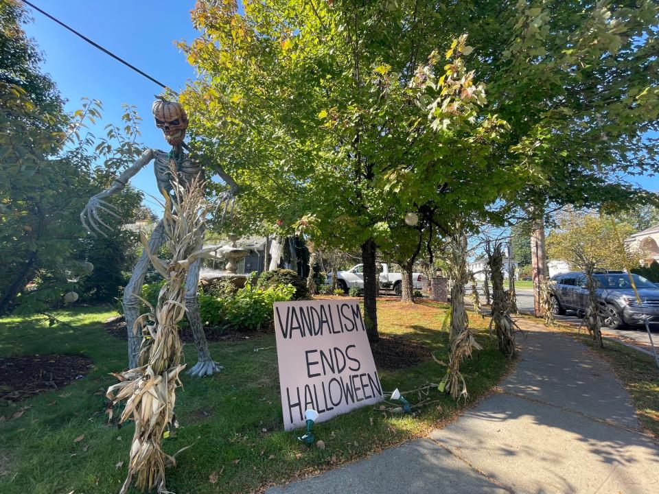 The annual Halloween display by Dr. Wayne Gangi on Grove Street has been taken down and replaced by a sign following vandalism.