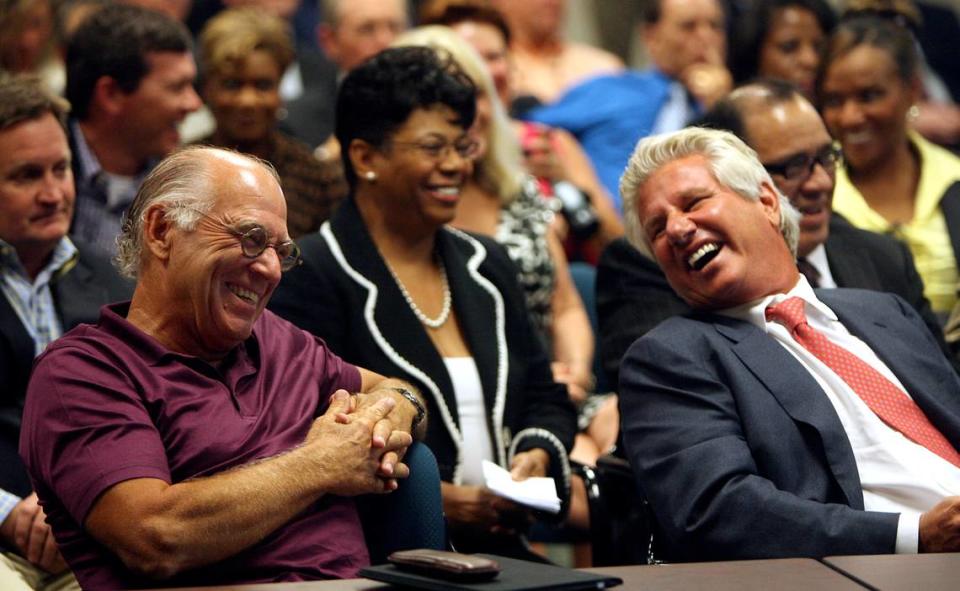 Singer Jimmy Buffett, left, and Margaritaville CEO John Cohlan, right, laugh at comments made by Gaming Commission Chairman Jerry St. Pe’ during a Gaming Commission meeting in 2011.