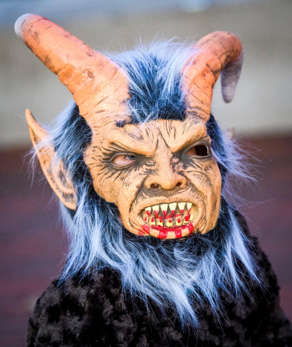 A young attendee to the 2021 Krampus Rampage & Bazaar wears a full costume during the parade. The annual celebration of naughty and nice is being revived by B-Town Krampus and Switchyard Brewing Company.