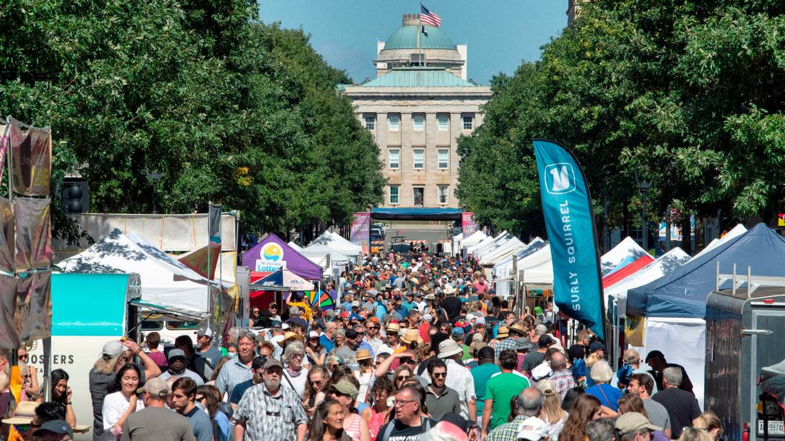 Bluegrass music fans and spectators pack Fayetteville Street in downtown Raleigh, N.C., Saturday, Oct. 2, 2021 for the IBMA Bluegrass Live! festival. Scott Sharpe/ssharpe@newsobserver.com