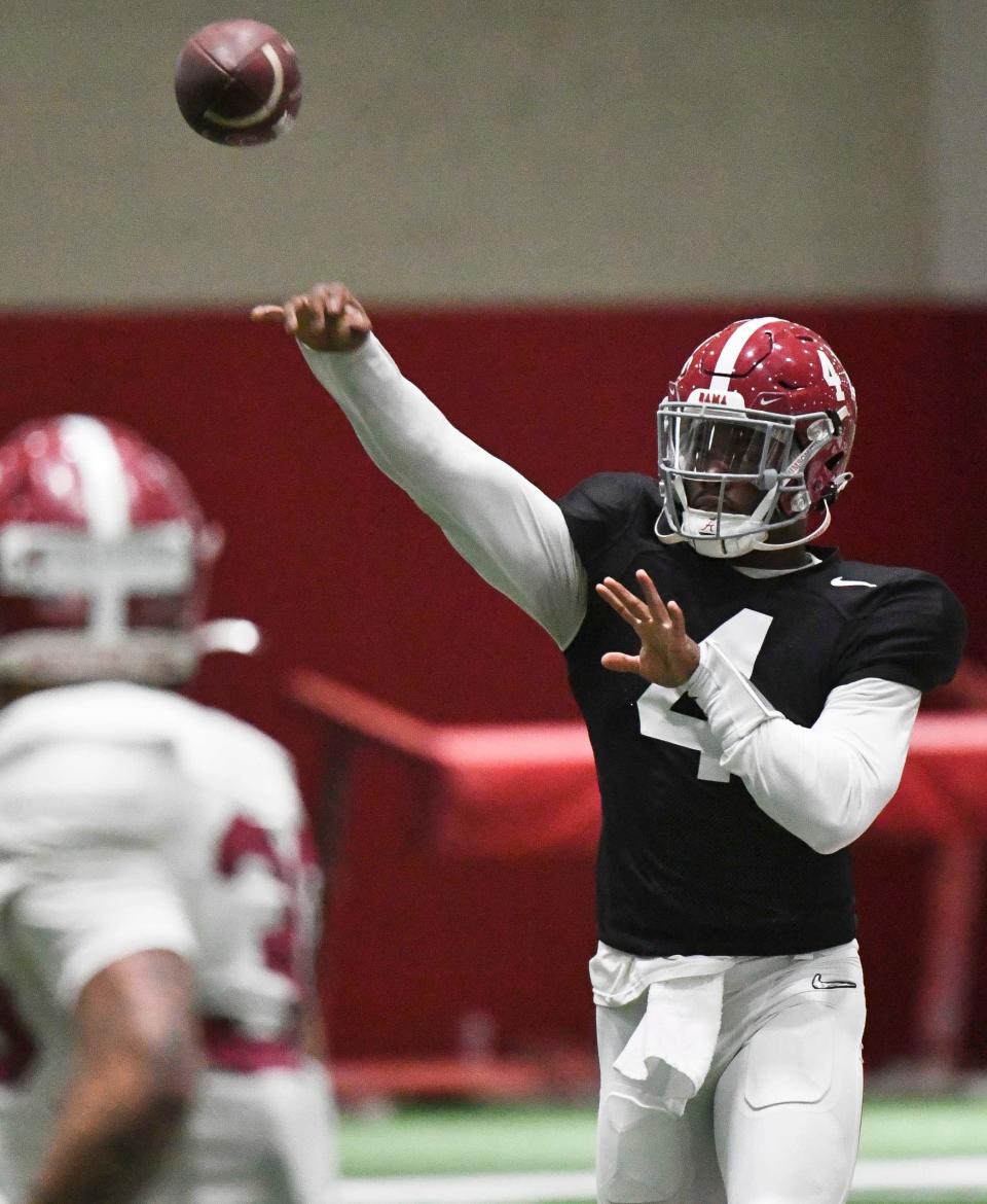 April 9, 2024; Tuscaloosa, Alabama, USA; Alabama quarterback Jalen Milroe (4) throws pass routes during practice in the Hank Crisp Indoor Practice Facility at the University of Alabama.