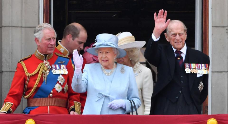 <p>The Queen waving to the crowd.</p>