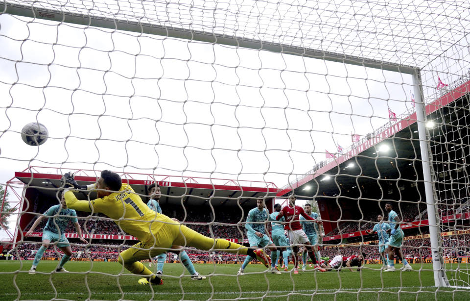 Nottingham Forest's Gibbs-White scores his side's first goal of the game during the Premier League soccer match between Nottingham Forest and Wolverhampton Wanderers at the City Ground, in Nottingham, England, Saturday April 13, 2024. (Nick Potts/PA via AP)