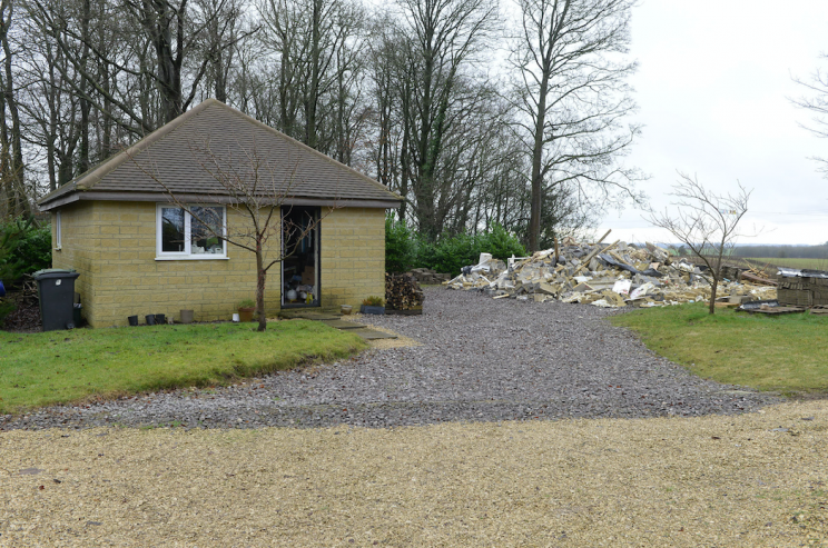 The ruins of the building can be seen on the right after it was demolished (SWNS)