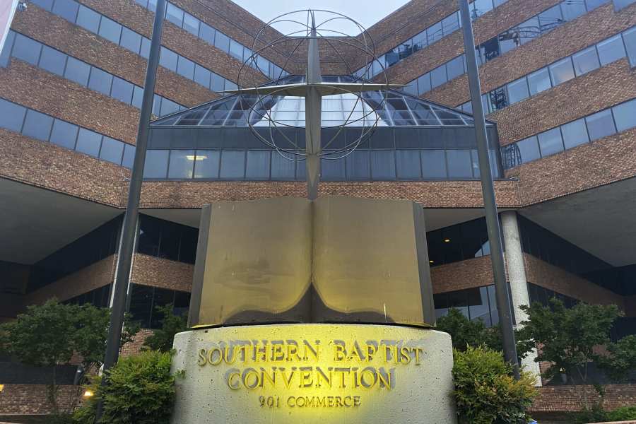 A cross and Bible sculpture stand outside the Southern Baptist Convention headquarters in Nashville, Tenn., May 24, 2022. (AP Photo/Holly Meyer)