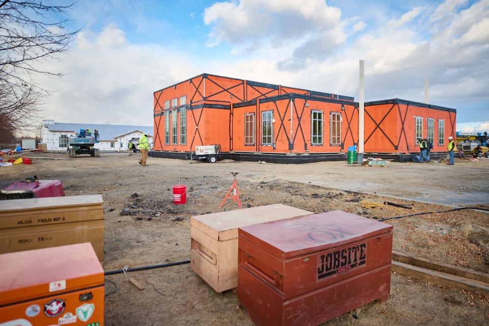 Workers install the prefabricated modules of the Helena Montana Temple on the temple site.