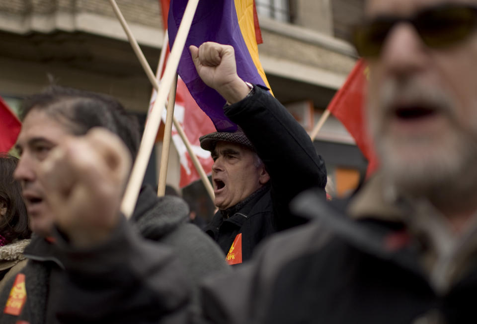 A man rises his fist as he protests against the economic policy of the Conservative Spanish Government, during a rally in Pamplona, northern Spain, Sunday, Feb. 19, 2012. The new conservative Popular Party government pledges new labor reforms to try to halt further job destruction as Spain already has the highest unemployment rate in the 17-nation eurozone with more than five millions unemployed and more than eleven million people are poor and at risk of social exclusion, by the strong economic crisis. (AP Photo/Alvaro Barrientos)