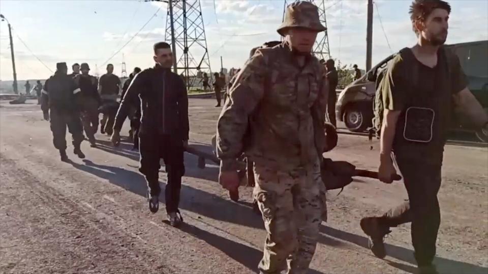 264 Ukrainian servicemen who had been holed up in the besieged Azovstal steel plant in Mariupol are allowed to leave by Russian forces, some of them being carried out on stretchers, as they are evacuated to a Russia controlled area on May 17, 2022 following negotiation mediated by the United Nations and International Red Cross. Ukrainian Fighters Evacuated, Mariupol, Ukraine - 17 May 2022 The Russian Defense Ministry said in the accompanying statement that 265 militants laid down their arms and surrendered, including 51 seriously wounded. They were sent to a hospital in the city of Novoazovsk, Donetsk People's Republic. Five buses and an armored personnel carrier carrying the servicemen arrived late on Monday in Novoazovsk, and some of the evacuees were carried out on stretchers into a hospital, a Reuters witness said. Novoazovsk is now under the control of Russia-backed separatists who have held parts of eastern Ukraine since 2014. It is unclear how many fighters still remain in the plant. Ukrainian authorities said the evacuated fighters will be used in exchange of Russian prisoners of war caught in Ukraine. It is unclear how many fighters still remain in the plant. Ukrainian authorities said the evacuated fighters will be used in exchange of Russian prisoners of war caught in Ukraine