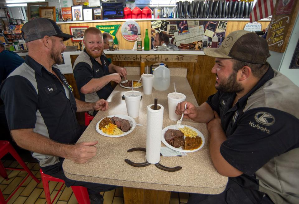 Coworkers (from left) Doug Bowers, Andrew Zane, and Ryan Cupelli, from Florida Coast Equipment in Fort Pierce, stop in at Carter's Grocery for lunch on Friday, May 27, 2022, on Orange Avenue west of Fort Pierce. "I came out here years ago, the first time I have seen this place is probably 8 years ago," Bowers said. 