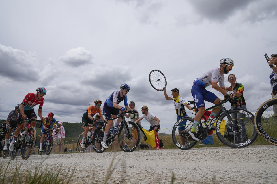 France's Anthony Turgis, right, leads before Canada's Derek Gee, center, during the ninth stage of the Tour de France cycling race over 199 kilometers (123.7 miles) with start and finish in Troyes, France, Sunday, July 7, 2024. (AP Photo/Jerome Delay)