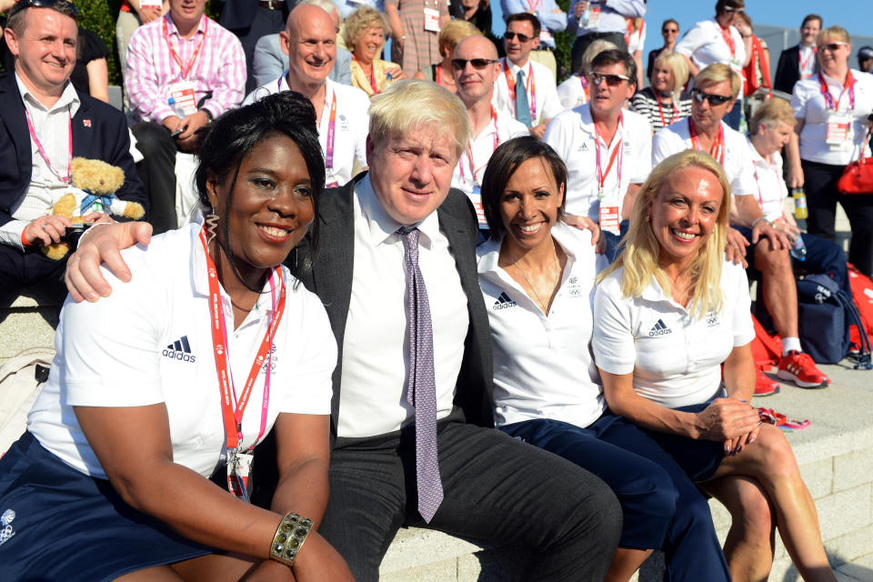 London Mayor Boris Johnson poses with Tessa Sanderson (left), Dame Kelly Holmes and Jayne Torvill (right) during the Welcome Ceremony at the Athletes Village, Olympic Park, London.