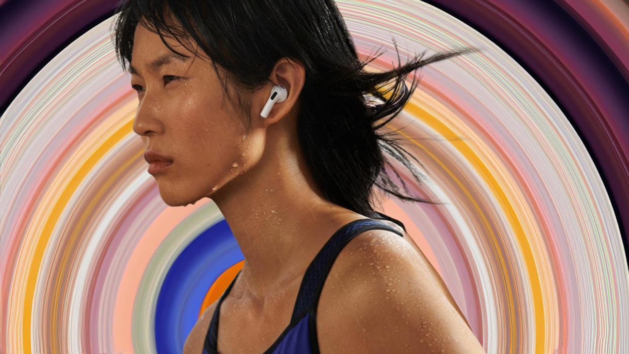  Runner wearing the Apple AirPods 3 against colourful background. 