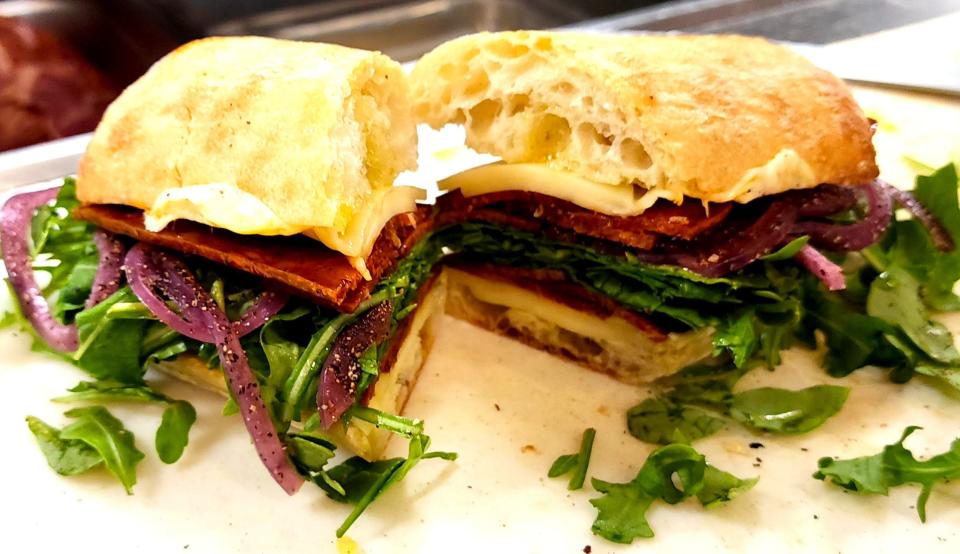 The Soupy Grinder at Westerly Packing in Westerly. Thin-sliced mild soppressata is topped with pickled red onions, extrav virgin olive oil, baby arugula, provolone cheese and served on a baguette.