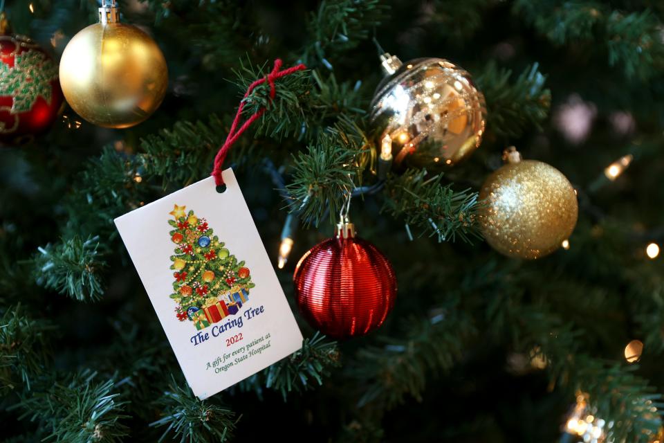 A tag listing gifts for a patient hangs on the Caring Tree at Oregon State Hospital in Salem.