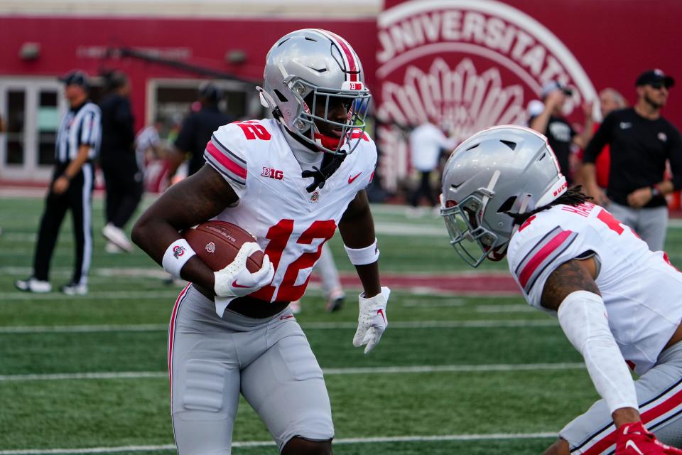 Sep 2, 2023; Bloomington, Indiana, USA; Ohio State Buckeyes cornerback Ryan Turner (12) warms up prior to the NCAA football game at Indiana University Memorial Stadium. Ohio State won 23-3.