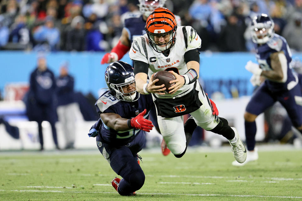 Joe Burrow's resilience helped the Bengals upset the AFC's top seed in Tennessee. (Photo by Andy Lyons/Getty Images)