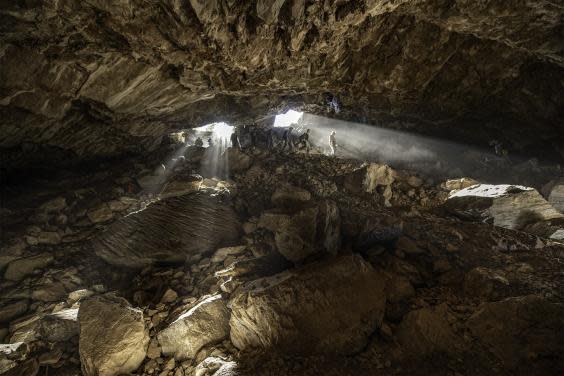 Archaeologists and other scientists, inside the cave in central Mexico, sampling material for radiocarbon dating (Devin A Gandy)