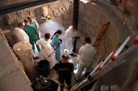 Experts open the ossuary at the Teutonic Cemetery at the Vatican