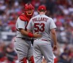 St. Louis Cardinals starting pitcher Andre Pallante gets some encouragement from catcher Austin Romine during the first inning of the team's baseball game against the Atlanta Braves on Tuesday, July 5, 2022, in Atlanta. The Braves scored five runs in the inning. (Curtis Compton/Atlanta Journal-Constitution via AP)
