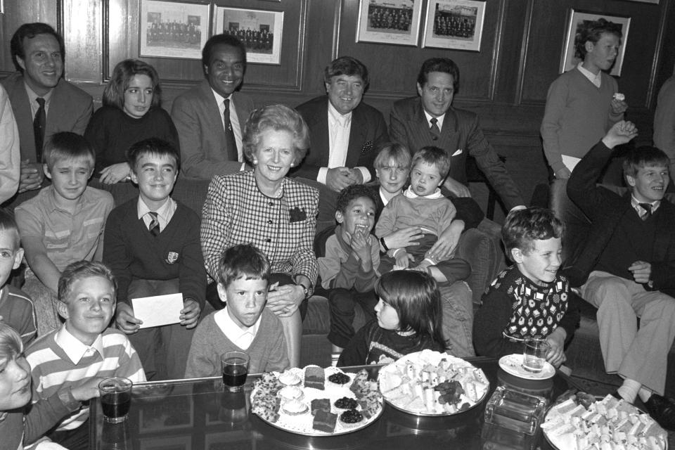 File photo dated 04/10/88 of a group of children from three special schools meeting the then Prime Minister Margaret Thatcher and comedians Jimmy Tarbuck and Kenny Lynch (centre) at a Variety Club reception at 12 Downing Street. Music star and entertainer Kenny Lynch has died at the age of 81.