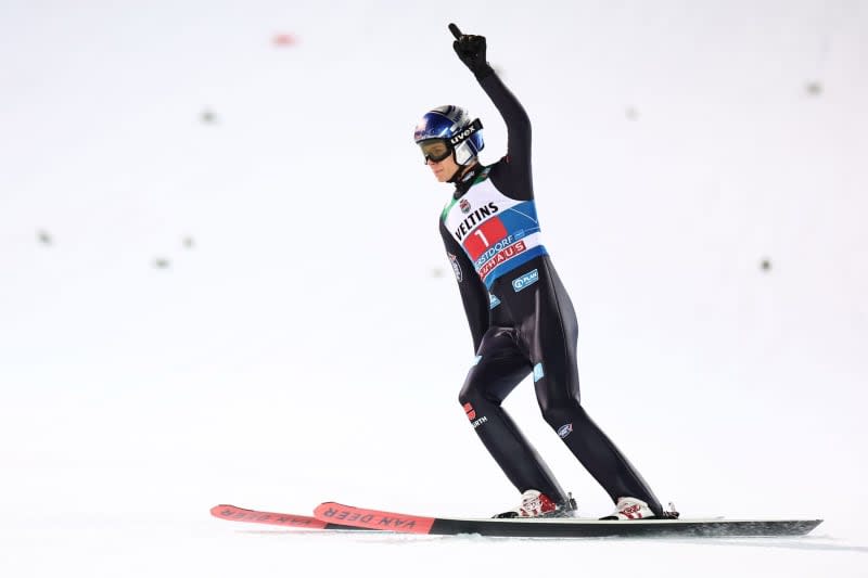 German ski jumper Andreas Wellinger celebrates after his jump in the finish area of the men's Four Hills Tournament large hill 2nd round of the Ski Jumping World Cup in Oberstdorf. Daniel Karmann/dpa