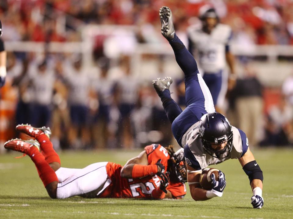 Utah defensive back Justin Thomas trips up Utah State receiver Andrew Rodriguez Friday, Sept. 11, 2015, at Rice Eccles Stadium in Salt Lake City. The Utes and Aggies will renew their rivalry beginning in 2024 after a lengthy hiatus. | Scott G Winterton, Deseret News