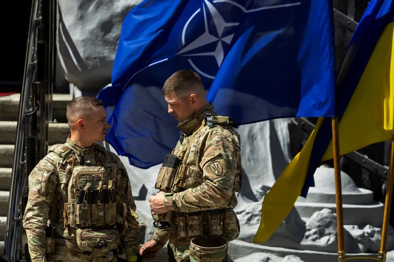 FILE PHOTO: Servicemen of Ukraine's presidential guard stand at the fringes of a press conference of Ukraine's President Volodymyr Zelenskiy and NATO Secretary-General Jens Stoltenberg in Kyiv