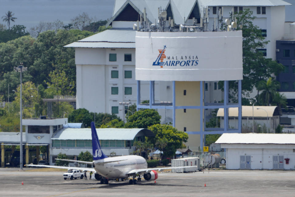 A Scandinavian Airlines medevac plane arrives at Langkawi, where the Norwegian king is being treated for an infection, in Malaysia, Friday, March 1, 2024. King Harald V, Europe's oldest monarch at 87, was hospitalized after he fell ill during a vacation, the royal palace in Oslo announced Tuesday. (AP Photo/Vincent Thian)