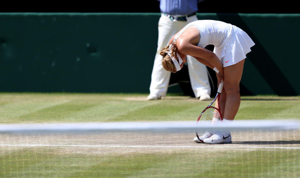 Germany's Sabine Lisicki reacts during her match against France's Marion Bartoli during day twelve of the Wimbledon Championships at The All England Lawn Tennis and Croquet Club, Wimbledon.