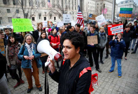 Immigration activists, including members of the DC Justice for Muslims Coalition, rally against the Trump administration's new ban against travelers from six Muslim-majority nations, outside of the U.S. Customs and Border Protection headquarters in Washington, U.S., March 7, 2017. REUTERS/Eric Thayer