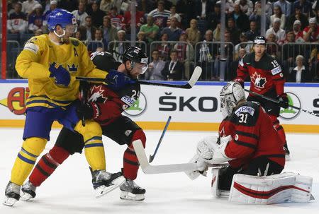 Ice Hockey - 2017 IIHF World Championship - Gold medal game - Canada v Sweden - Cologne, Germany - 21/5/17 - Calvin de Haan and goalkeeper Calvin Pickard of Canada in action against Gabriel Landeskog of Sweden. REUTERS/Grigory Dukor