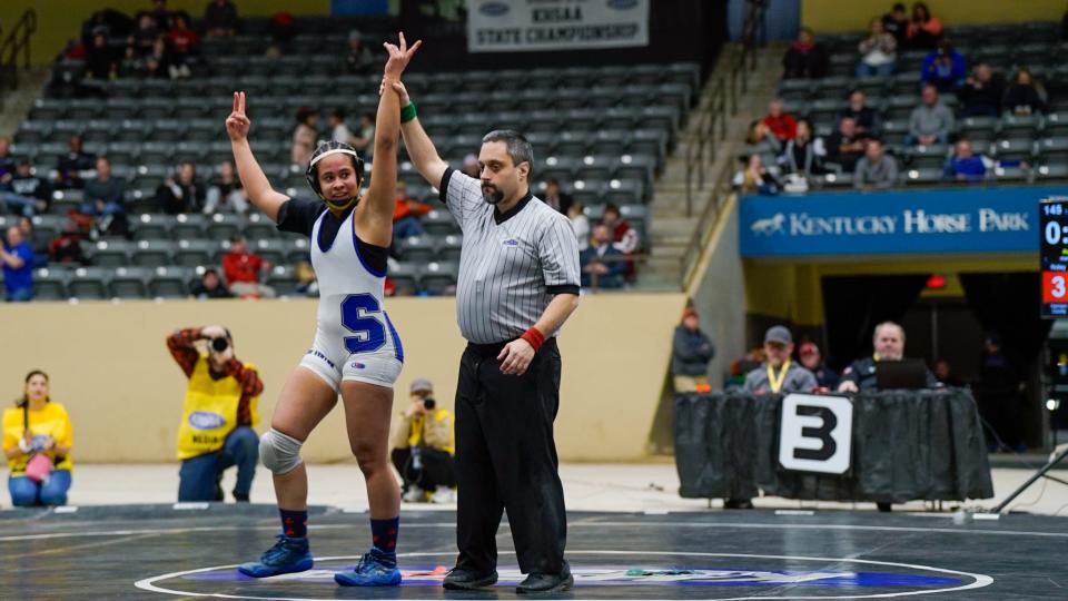 Simon Kenton's Gabriella Ocasio looks to her coaches as she is declared the 145-pound state champion at the KHSAA girls wrestling state tournament on Feb. 17, 2024 at Alltech Arena in Lexington, Ky.