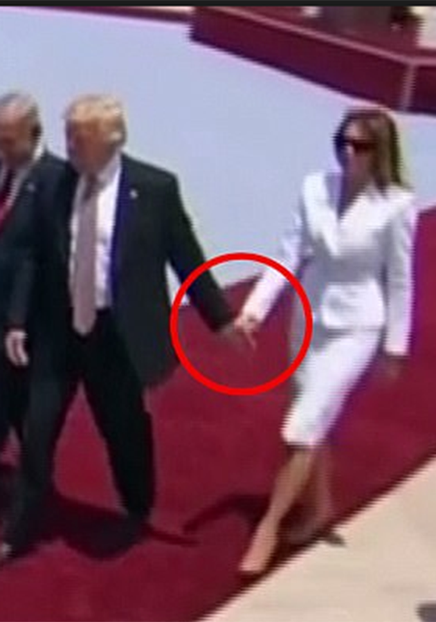 However she appears to 'slap' away her husband's hand when he reaches for her. Photo: YouTube