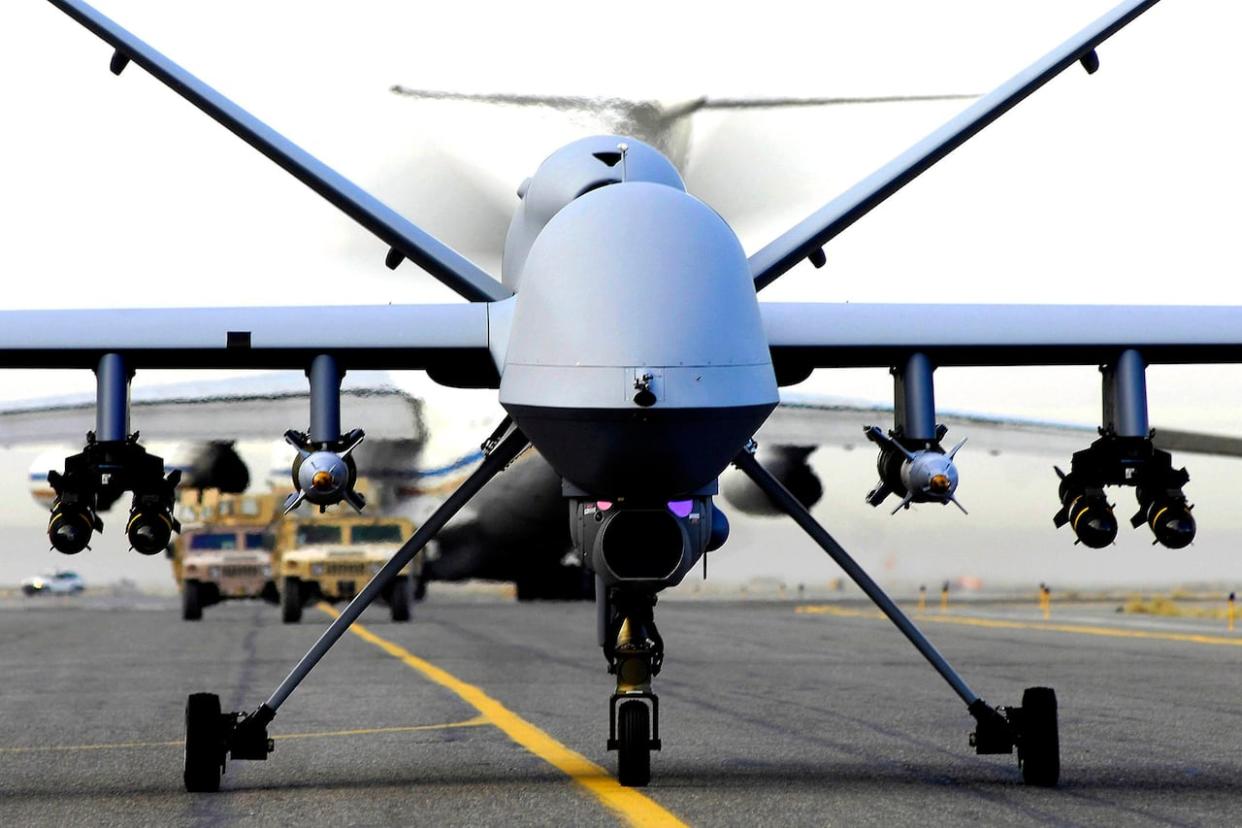 In this image released by the U.S. Air Force, a fully armed MQ-9 Reaper unmanned aerial vehicle taxis down the runway at an air base in Afghanistan on Nov. 4, 2007. (Staff Sgt. Brian Ferguson/The Associated Press - image credit)