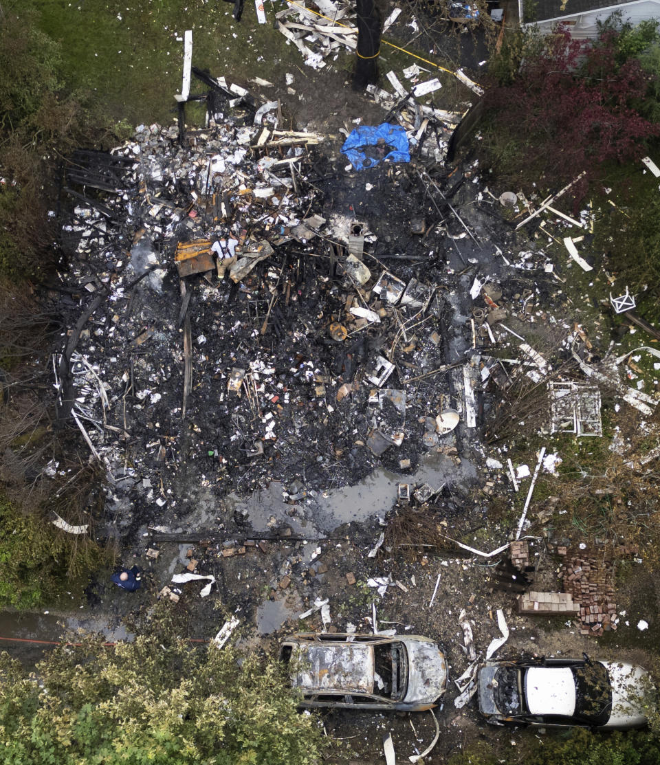 A home was leveled at the 23500 block of North Overhill Road, after an explosion destroyed it in unincorporated Lake Zurich, Ill., Wednesday, June 5, 2024. The state fire marshal is investigating the cause. (Paul Valade/Daily Herald via AP)
