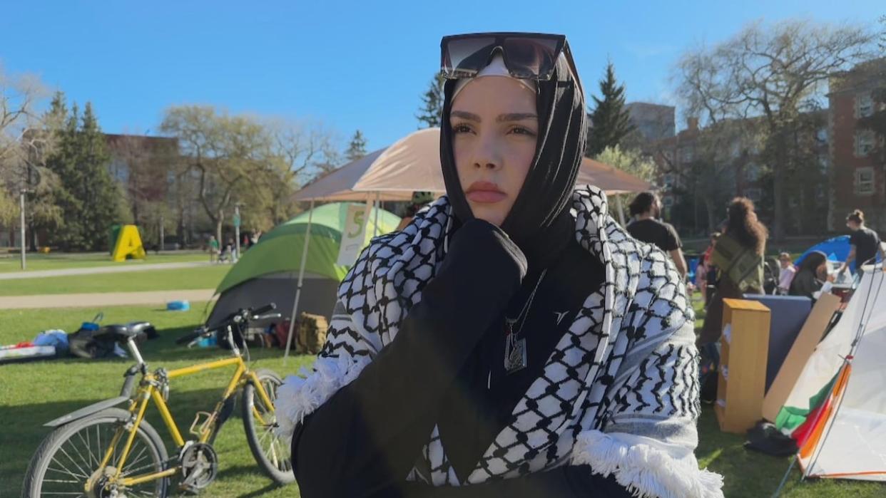 Abraar Alsilwadi is an organizer and student at the University of Alberta. She and other protesters have set up an encampment at the university to call for disclosure and the severing any ties with Israel. (Mrinali Anchan/CBC - image credit)