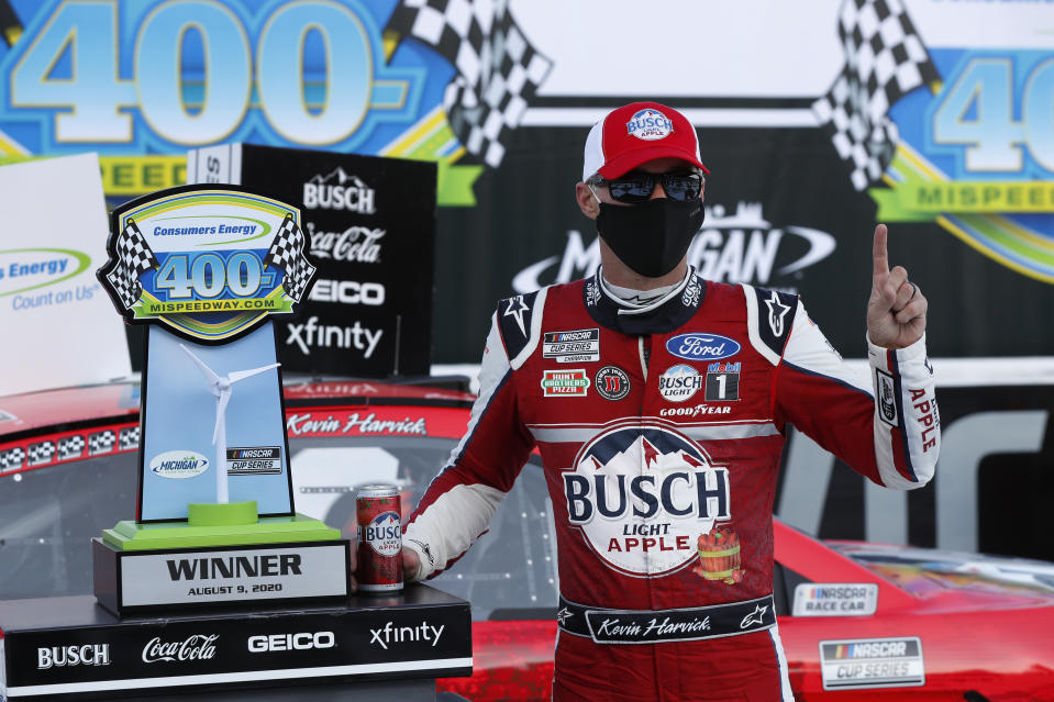 Kevin Harvick celebrates after winning a NASCAR Cup Series auto race at Michigan International Speedway in Brooklyn, Mich., Sunday, Aug. 9, 2020. (AP Photo/Paul Sancya)