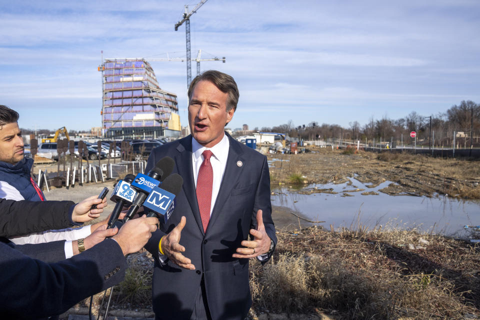 Virginia Gov. Glenn Youngkin speaks with reporters after an event where he and Ted Leonsis, owner of the Washington Wizards NBA basketball team and Washington Capitals HNL hockey team, announce plans for a new sports stadium for the teams, Wednesday, Dec. 13, 2023, in Alexandria, Va. Virginia Gov. Glenn Youngkin has reached a tentative agreement with the parent company of the NBA's Washington Wizards and NHL's Washington Capitals to move those teams from the District of Columbia to what he called a new "visionary sports and entertainment venue" in northern Virginia. (AP Photo/Alex Brandon)