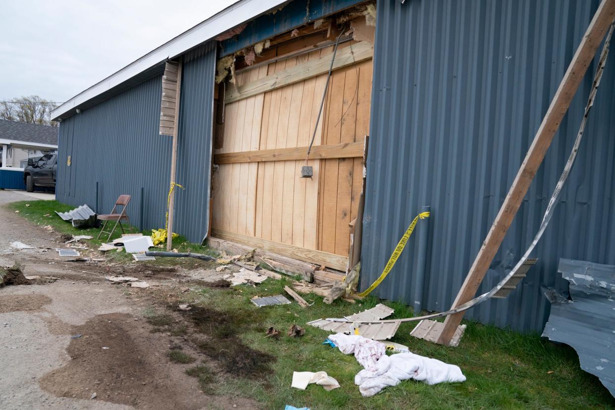 A boarded up section of the Swan Boat Club in Berlin Township, photographed Sunday, is where an alleged drunked driver smashed through a wall at the club during a child's birthday party Saturday.