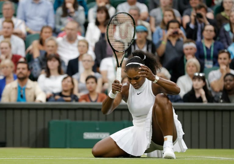 US player Serena Williams reacts after losing a point to Christina McHale during their women's singles second round match at Wimbledon, on July 1, 2016