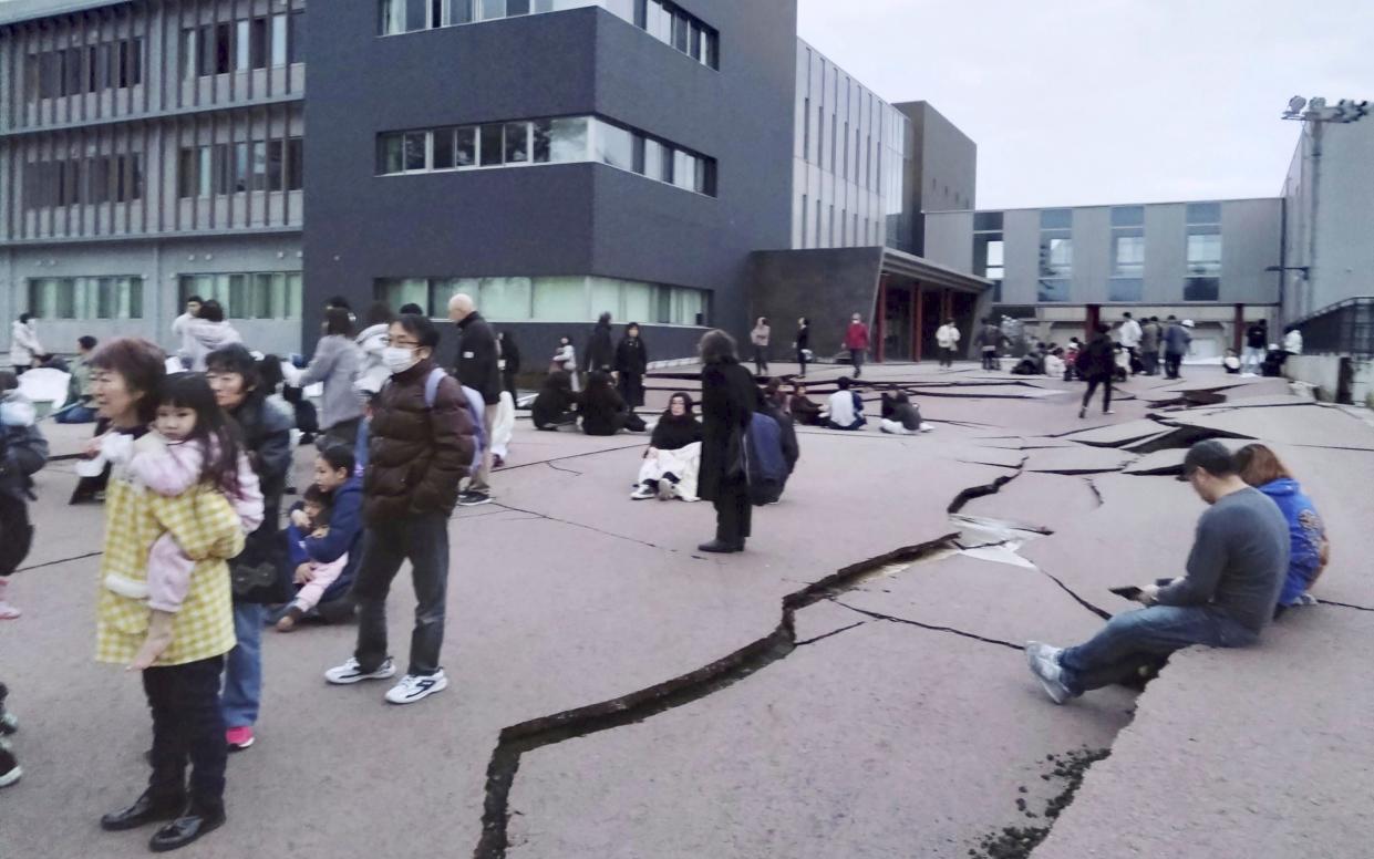 Cracks are seen on the ground in the city of Wajima in Ishikawa, northern Japan