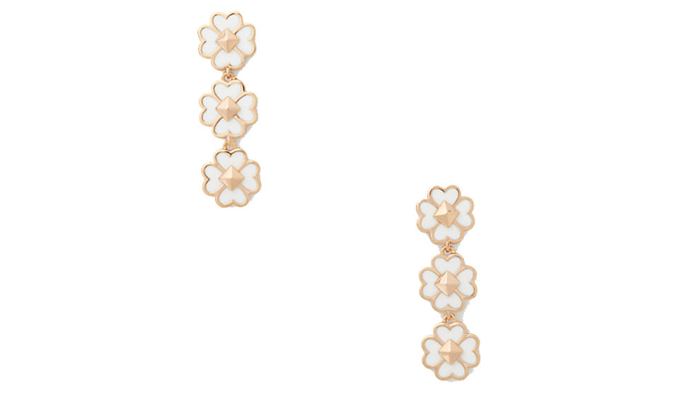 Pair of triple-daisy drop earrings in gold and white enamel. 