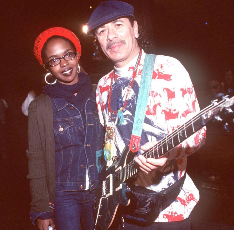Lauryn Hill (left) and Carlos Santana, pictured backstage at the 41st Annual Grammy Awards in Los Angeles on February 24, 1999