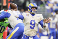 Los Angeles Rams quarterback Matthew Stafford (9) passes against the Seattle Seahawks during the first half of an NFL football game, Thursday, Oct. 7, 2021, in Seattle. (AP Photo/Elaine Thompson)