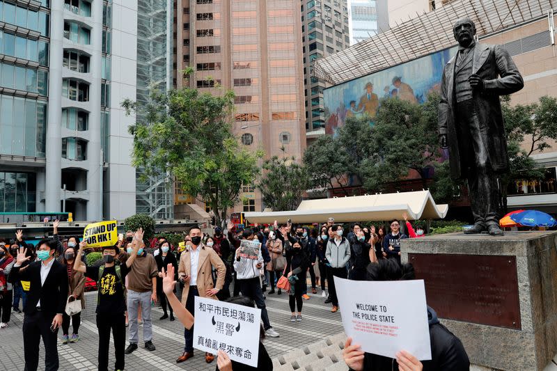 Anti-government protesters take part at a lunchtime protest outside HSBC headquarters in Hong Kong