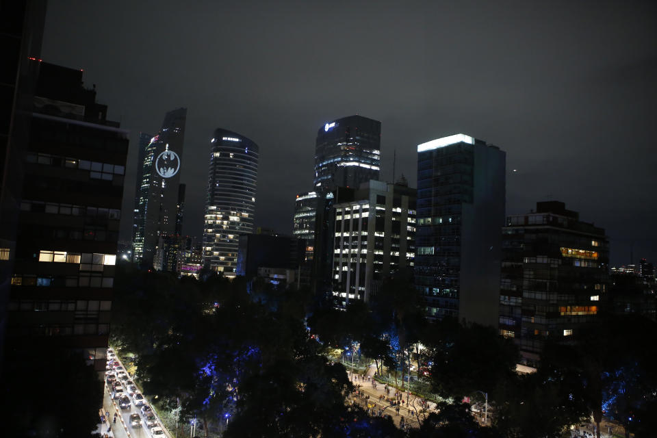A Bat signal light is lit in the Torre Reforma during the commemorating of Batman's 80th anniversary in Mexico City, Saturday, Sept. 21, 2019. (AP Photo/Ginnette Riquelme)