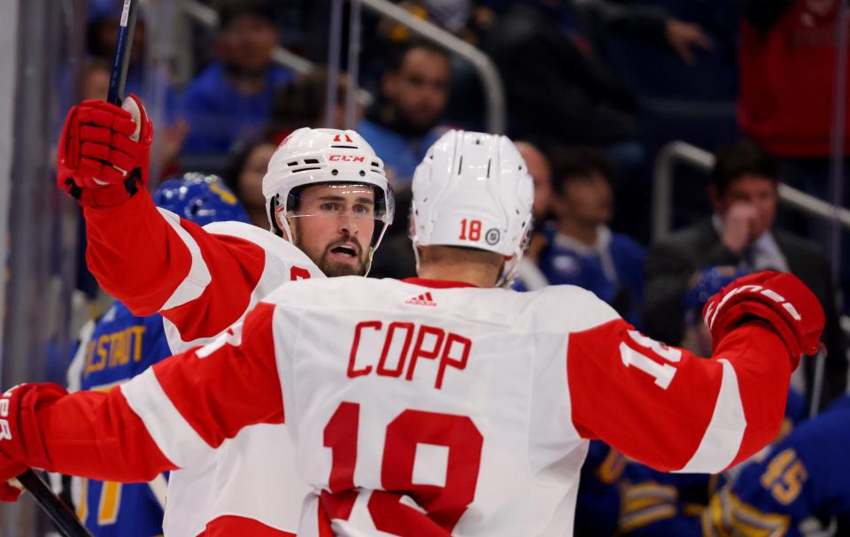 Detroit Red Wings center Dylan Larkin (71) celebrates his goal with center Andrew Copp (18) during the third period against the Buffalo Sabres at KeyBank Center in Buffalo, N.Y., on Monday, Oct. 31, 2022.