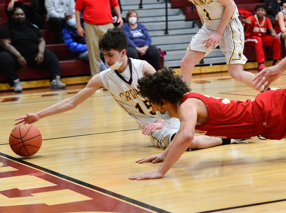 Case's Aiden Parent and Bishop Connolly's Brandan DeFaria attempt to keep the ball in play during last season's game.