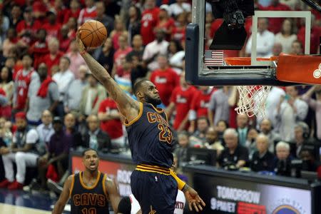 May 20, 2015; Atlanta, GA, USA; Cleveland Cavaliers forward LeBron James (23) dunks against the Atlanta Hawks during the fourth quarter of game one of the Eastern Conference Finals of the NBA Playoffs at Philips Arena. Cleveland won 97-89. Mandatory Credit: Brett Davis-USA TODAY Sports